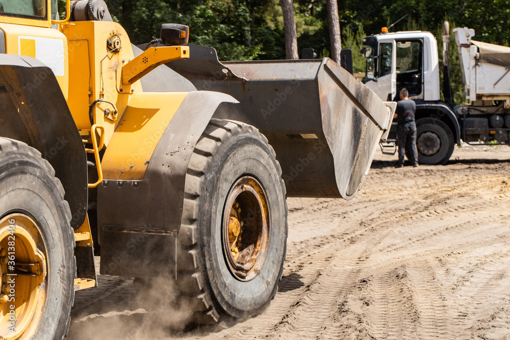 Excavator at a construction site, backhoe bucket, Excavator at a construction site, backhoe bucket,