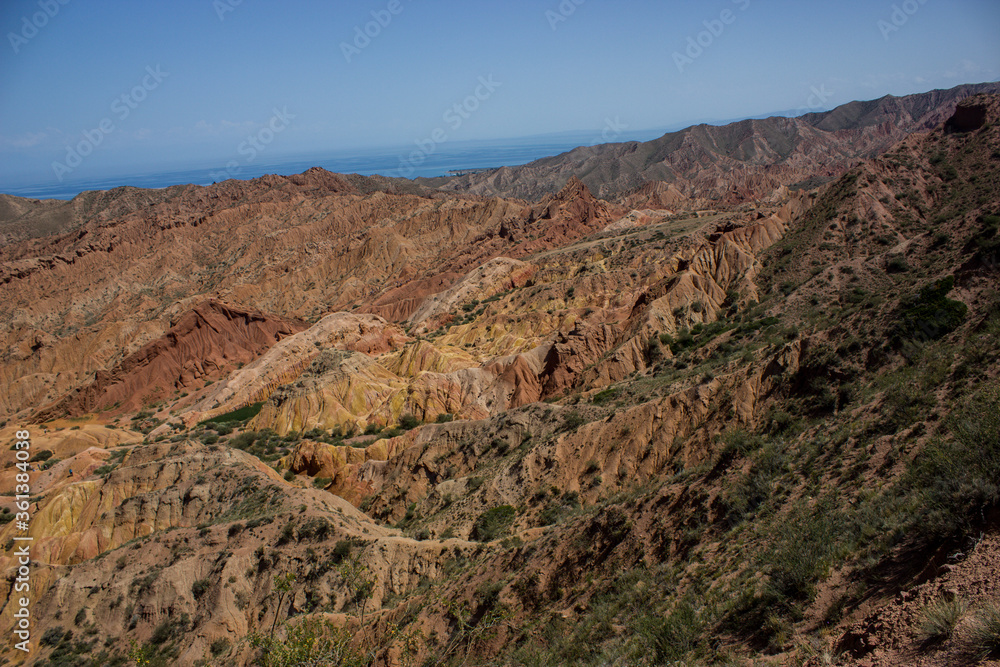 Red canyon valley scenery. Beautiful sunny landscape with sand, rocks and hills. National park summer view