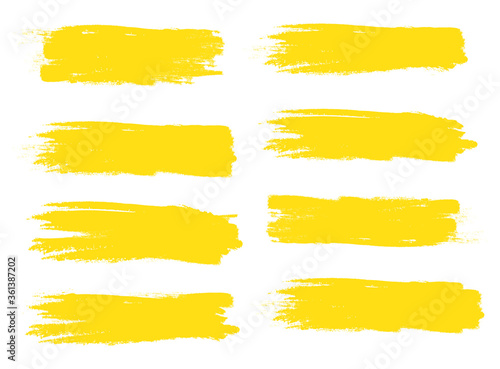 Yellow brush stroke set isolated on white background. Trendy brush stroke vector for ink paint, grunge backdrop, dirt banner, watercolor design and dirty texture. Brush stroke vector