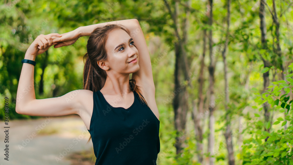 Young fit caucasian girl exercising in park before jogging. Copy space Young fit caucasian girl exercising in park before jogging. Copy space