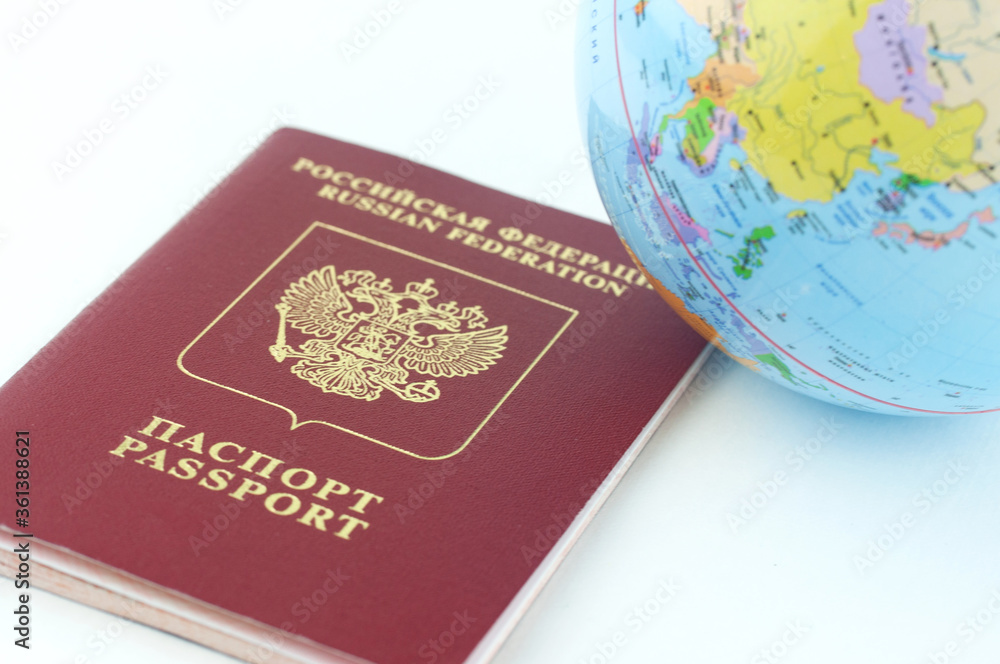 Globus in the passport house, travel and leisure concept Globus in the passport house, travel and leisure concept