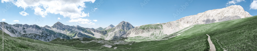 panoramic view of the Appennini Gran Sasso in meadow from Campo Imperatore in Italy landscape format