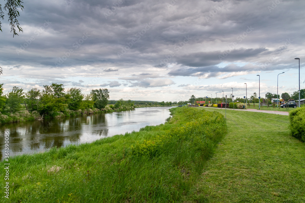 Boulevards on Narew river in the evening in Lomza.