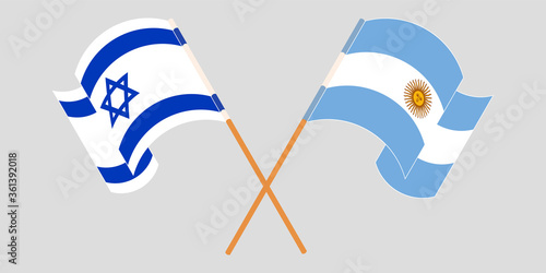 Crossed and waving flags of Israel and Argentina