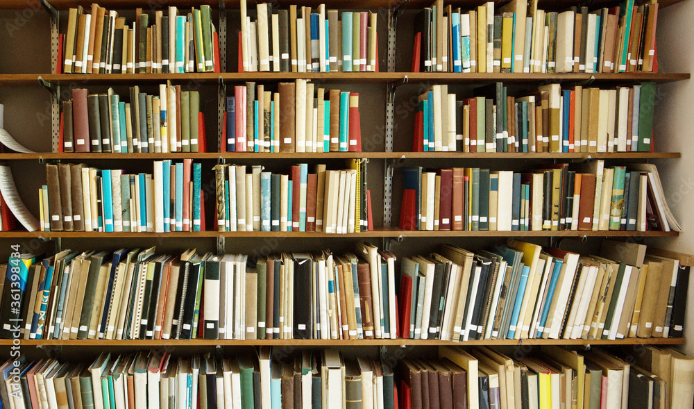 old books on a shelf old books on a shelf