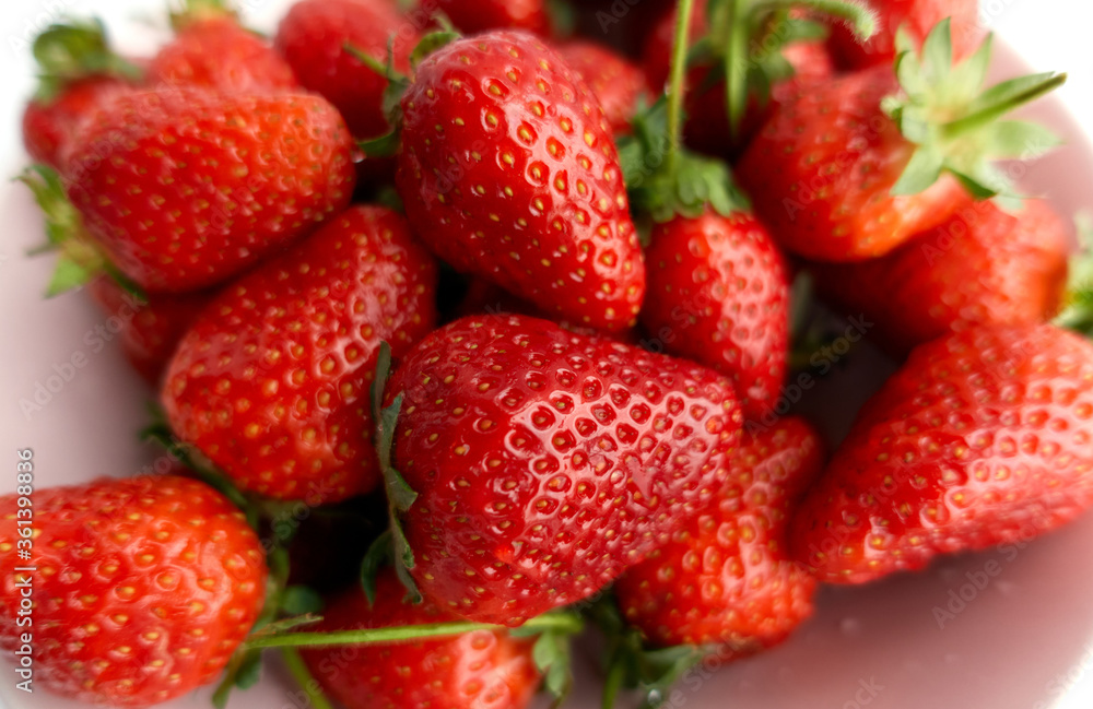 Closeup summer fresh red strawberries. Natural ripe berries. Vegetarian and healthy eating concept. Closeup summer fresh red strawberries. Natural ripe berries. Vegetarian and healthy eating concept.