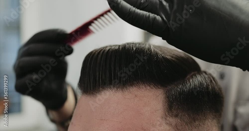 Classic hair styling with paste and wax. Vintage haircut.
