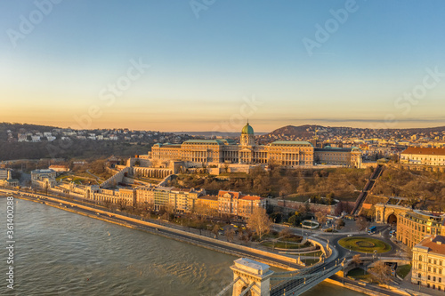 Aerial drone shot of Buda castle on Buda hill during Budapest sunrise morning glow © Davidzfr