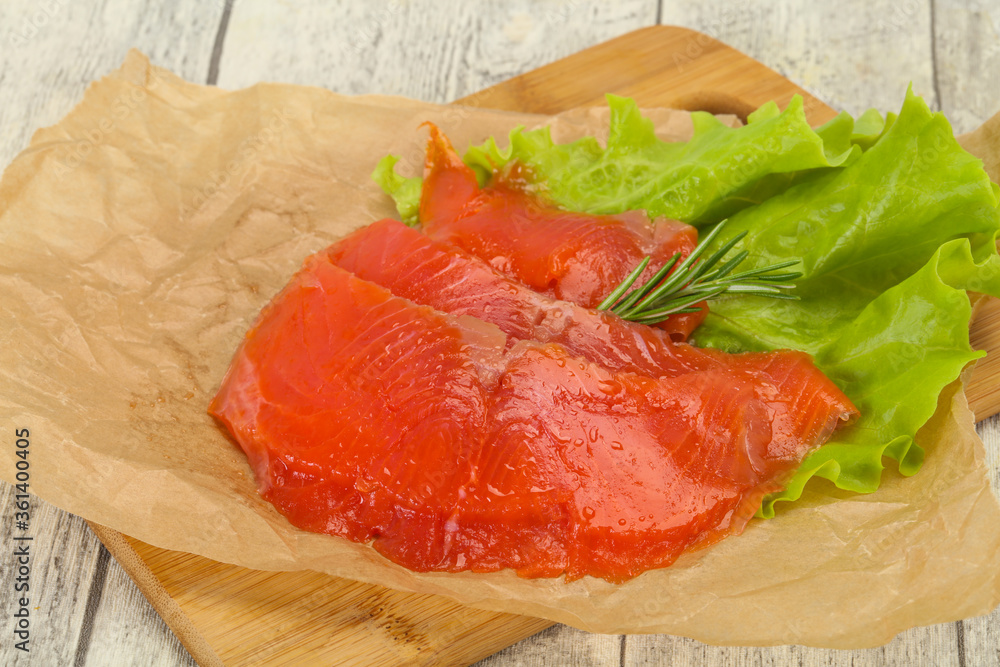 Sliced salmon fillet served rosemary Sliced salmon fillet served rosemary