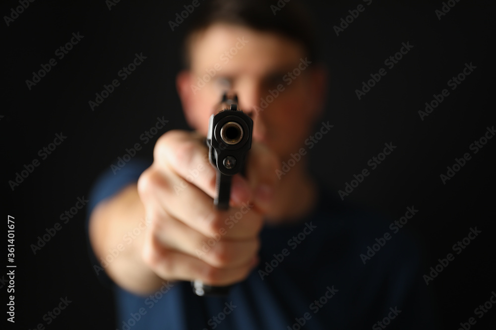 Man hold pistol. Selective focus. Self defense weapon Man hold pistol. Selective focus. Self defense weapon