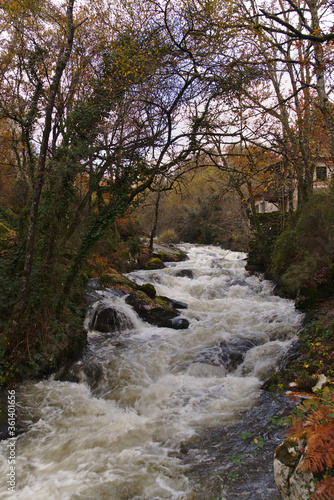 River stream with rapids and high flow in autumn in Galicia mountain