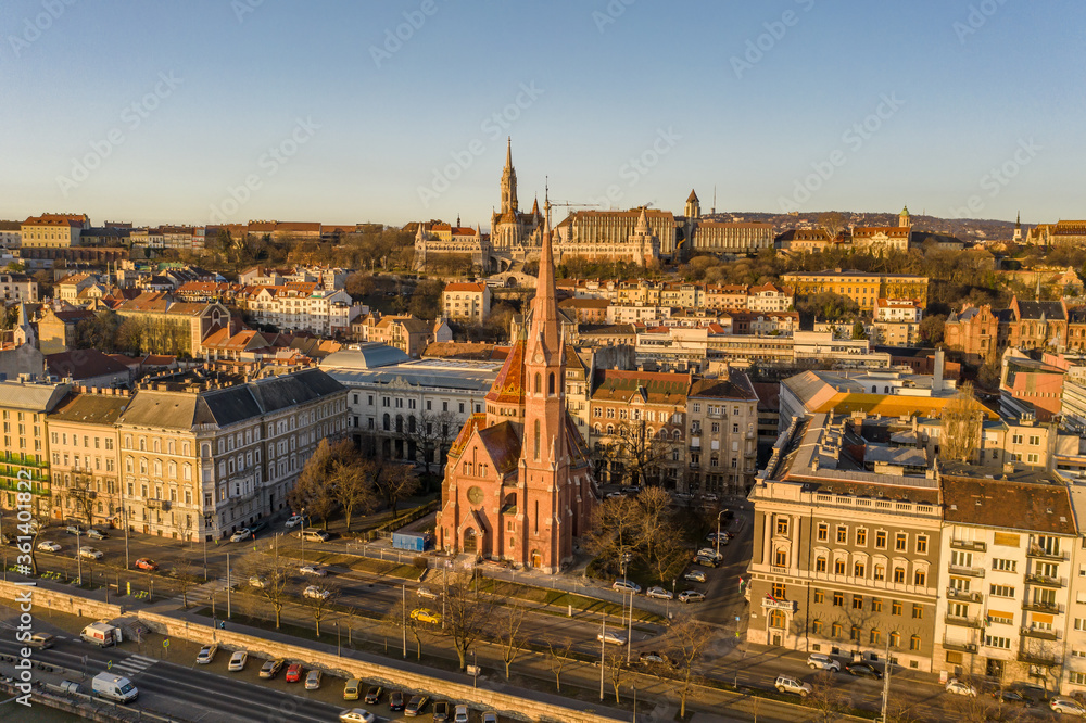 Aerial drone shot of Szilagy Dezso Square reformed church Matthias Church during Budapest sunrise