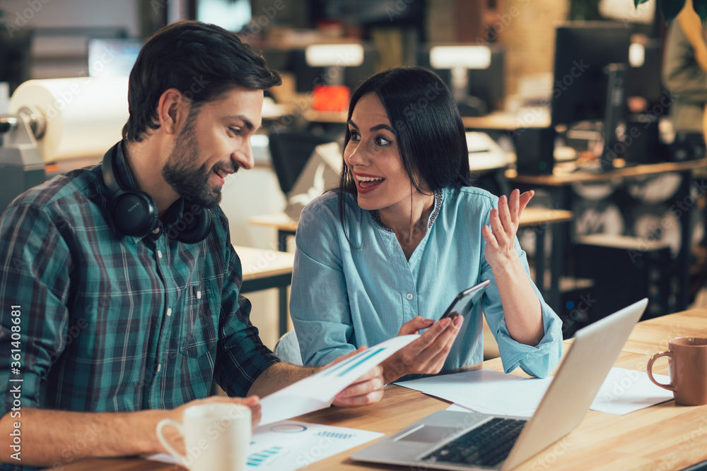 Excited lady getting amazing job offer and sharing her joy with colleague Excited lady getting amazing job offer and sharing her joy with colleague
