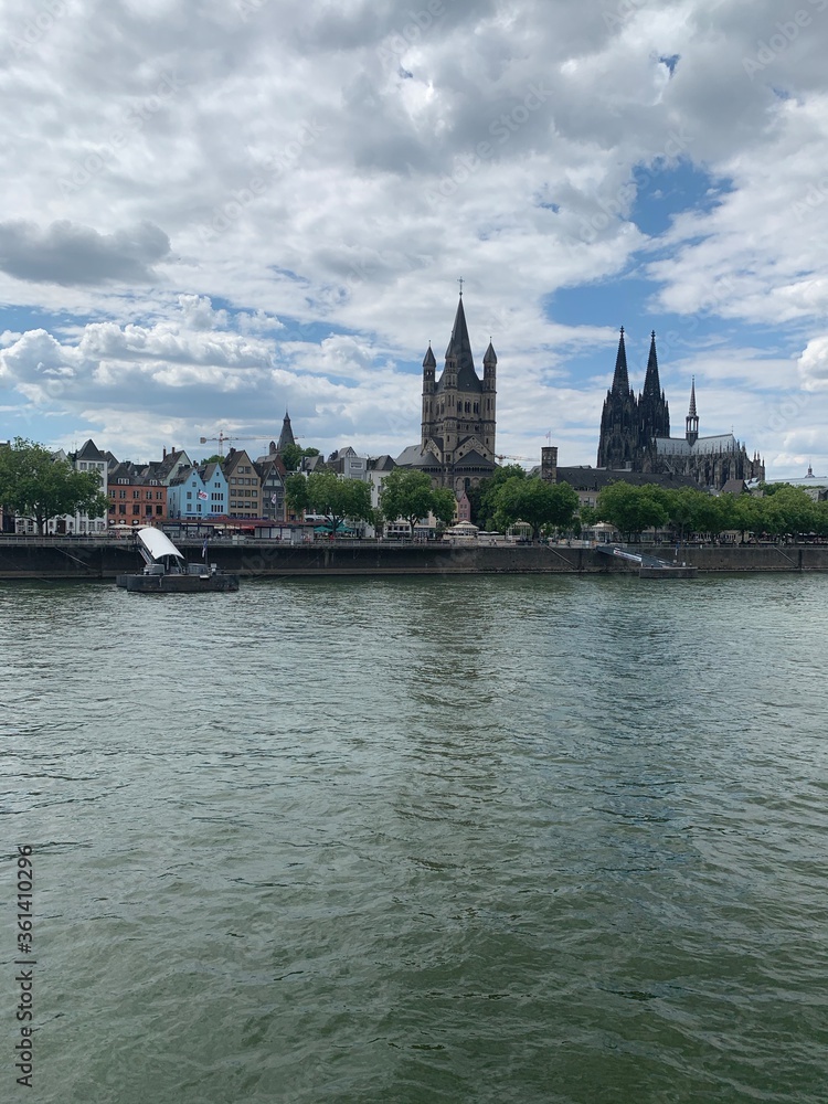 Cologne city skyline with Great St. Martin Church, Cologne Cathedral and Rhine river.