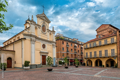 Fototapeta Naklejka Na Ścianę i Meble -  Church and historic house on small town square in Alba, Italy.