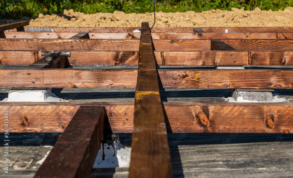 wooden frame on bricks for laying the terrace