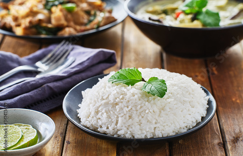 thai style jasmine rice on plate on wooden table top