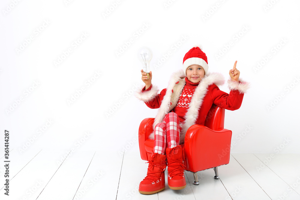Obraz premium Little boy in a Christmas outfit. Concept of Christmas shopping, sales, preparations.
