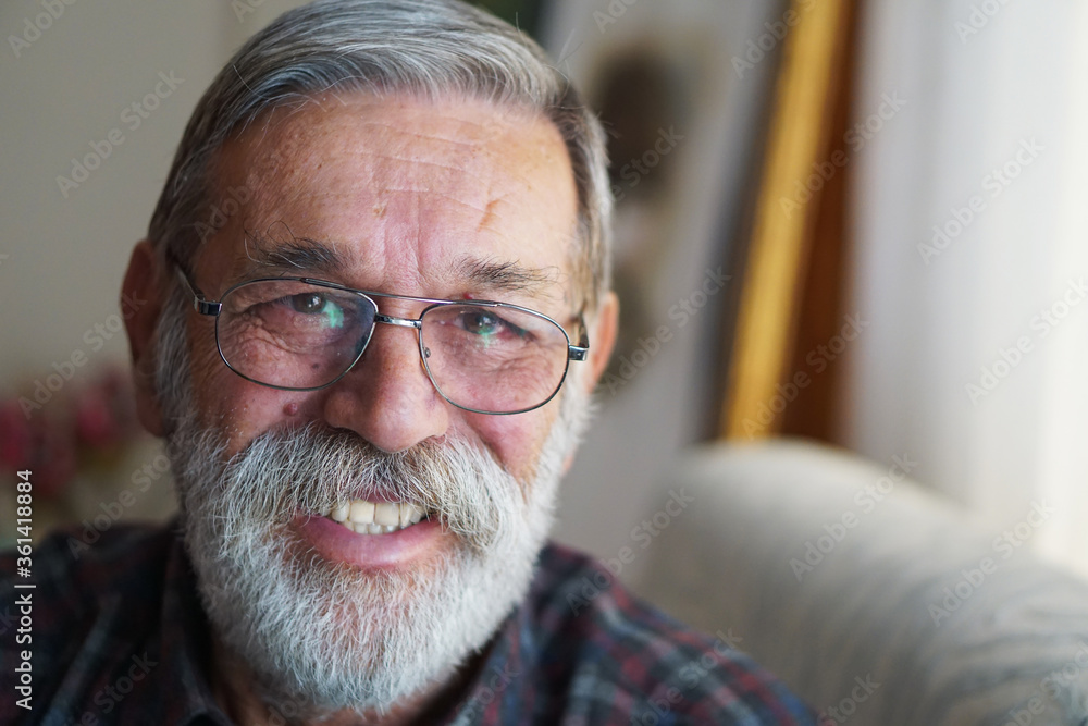 Portrait of a handsome senior man with beard smiling. Portrait of a handsome senior man with beard smiling.