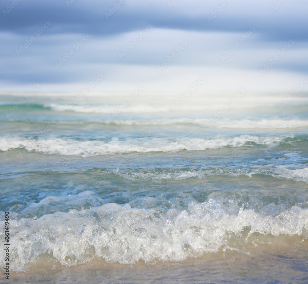 Sea wave on the sandy beach.Summer vacation background. Sea wave on the sandy beach.Summer vacation background.