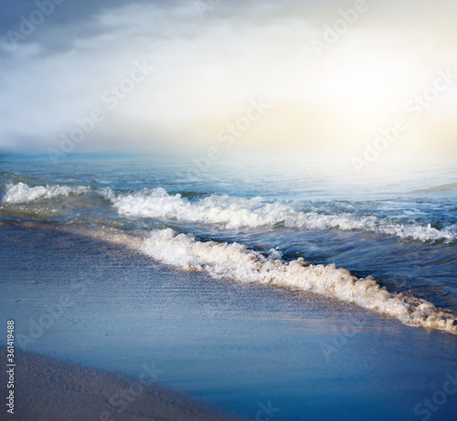 Sea wave on the sandy beach.Summer vacation background. © chokchaipoo