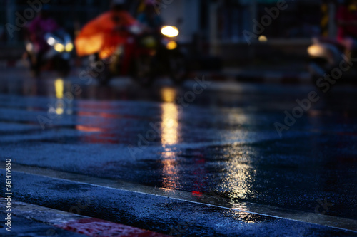 Night scene of city light after hard rain fall.Selective focus. © chokchaipoo