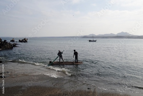 Squid fishing rafts (balsas) between Foca Island and Yacila, near Paita, Peru photo