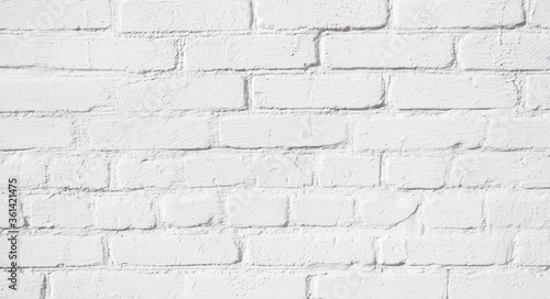Hand made painted white brick wall close-up, loft. Qualitative background or texture.