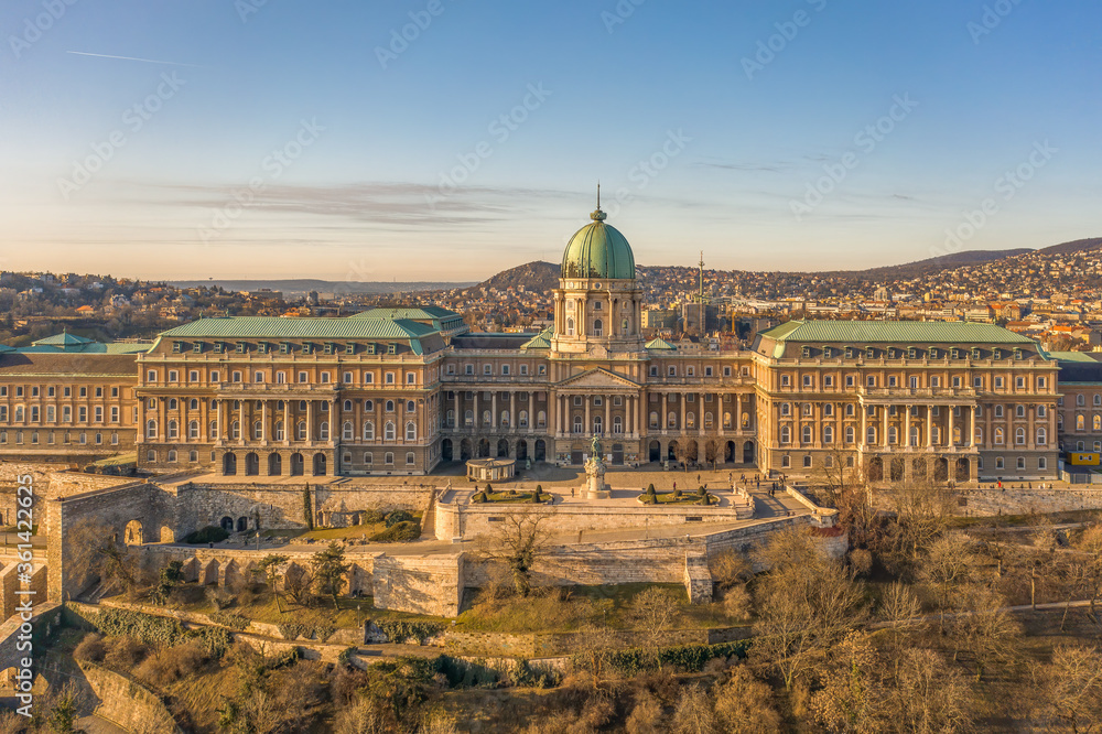 Aerial drone shot of front facade of Buda castle palace complex during Budapest morning sunrise