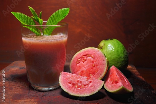 Guava juice isolated on wooden background