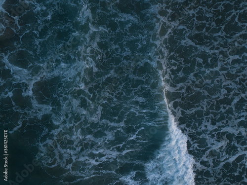 Aerial photo of waves breaking near a rural surf beach, New Zealand. 