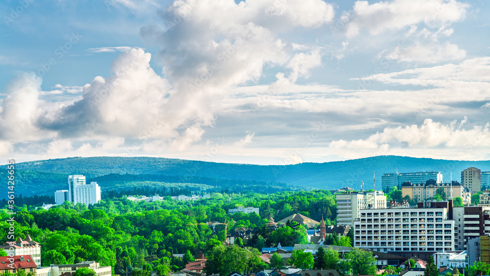 Fototapeta premium City landscape with clouds, Truskavets, Ukraine. View from hill.