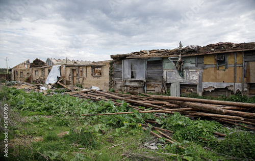 Abandoned ruins of a wooden house, farm. Old industrial building. © kurtov