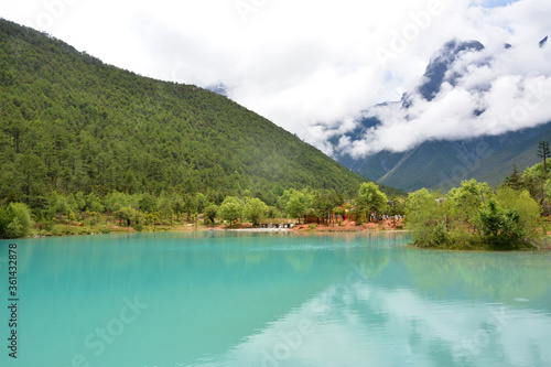 Wallpaper Mural green lake have reflection of the mountain under the white clouds Torontodigital.ca