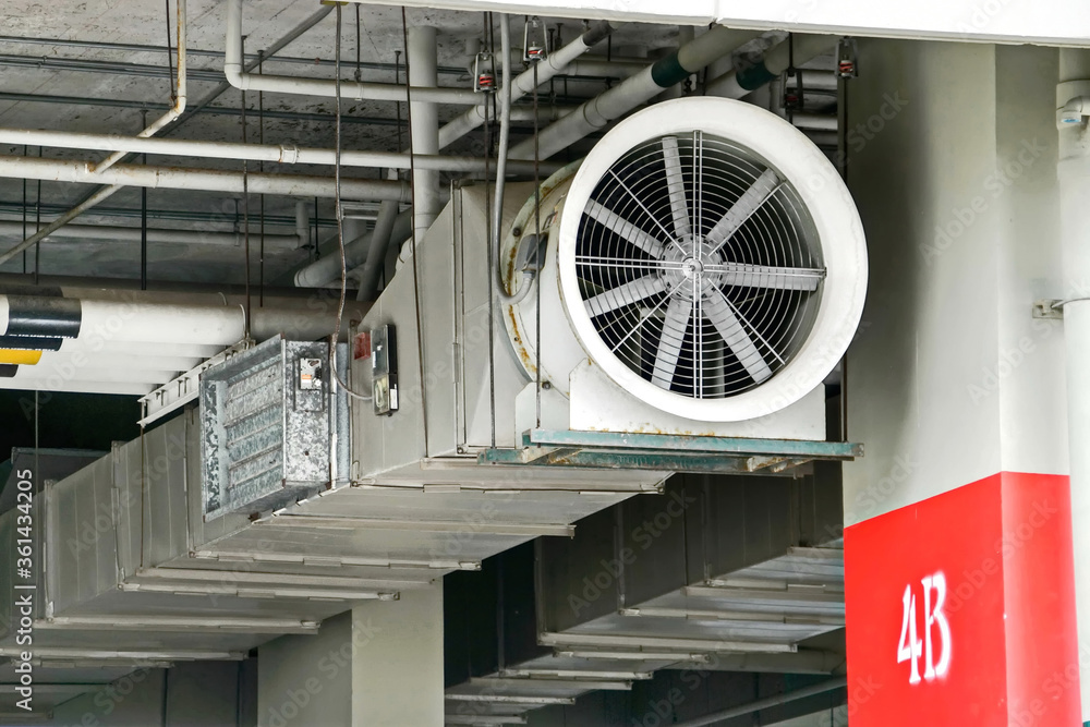 Ventilation System Parking Lot. Big fan.construction work.Smoke