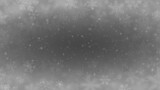Christmas background of snowflakes of different shapes, sizes, blur and transparency in gray colors