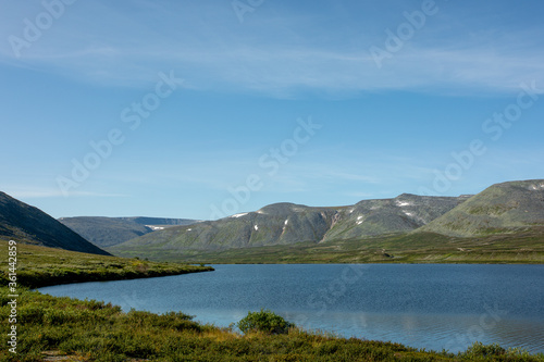 Mountain landscape, lake and mountain range, large panorama, Subpolar Urals. Beautiful landscape.