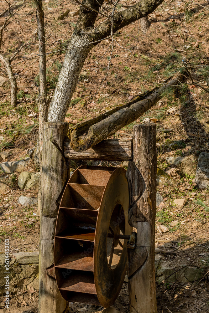 Old, rusted, metal waterwheel