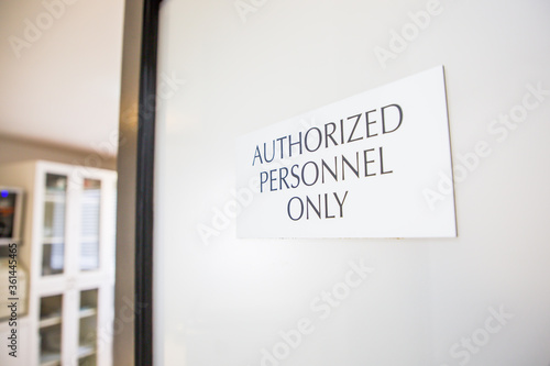 Authorized Personnel Only sign at oral surgery dental medical office practice sterilization room staff equipment and instrumentation area