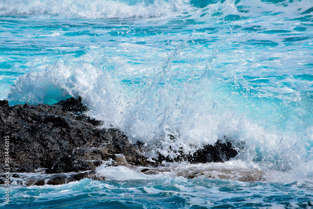 Coast of Santa Cruz de Tenerife, wave splashing on a rock