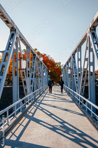 Old Iron bridge crossing Asahi river at Okayama castle, Japan photo