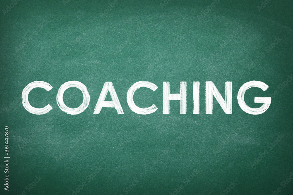 Obraz premium Adult learning. Word COACHING written on green chalkboard