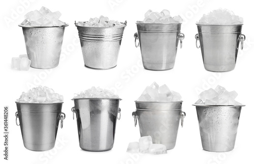 Set of different metal buckets with ice cubes on white background