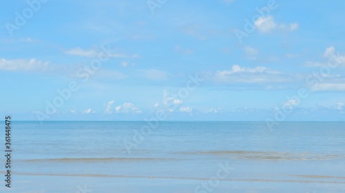 Sky with clouds above the ocean, calm water surface