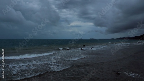 Rain storm sky with clouds moving above the seascape