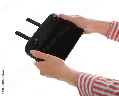 Woman holding new modern drone controller on white background, closeup of hands