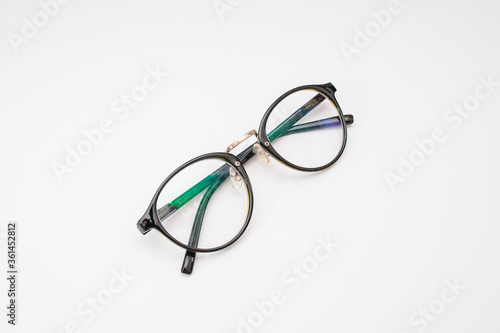 Vintage round eyeglasses on white background
