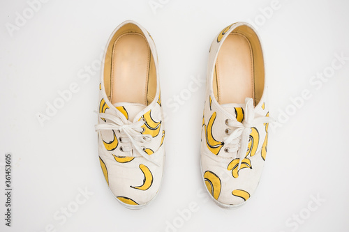 Banana striped shoes on white background