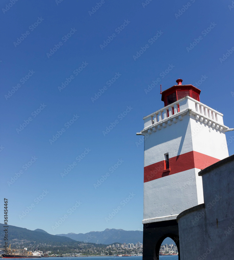 lighthouse on the coast of the sea, Red and White Light House in Canada, A lighthouse in Vancouver Harbor