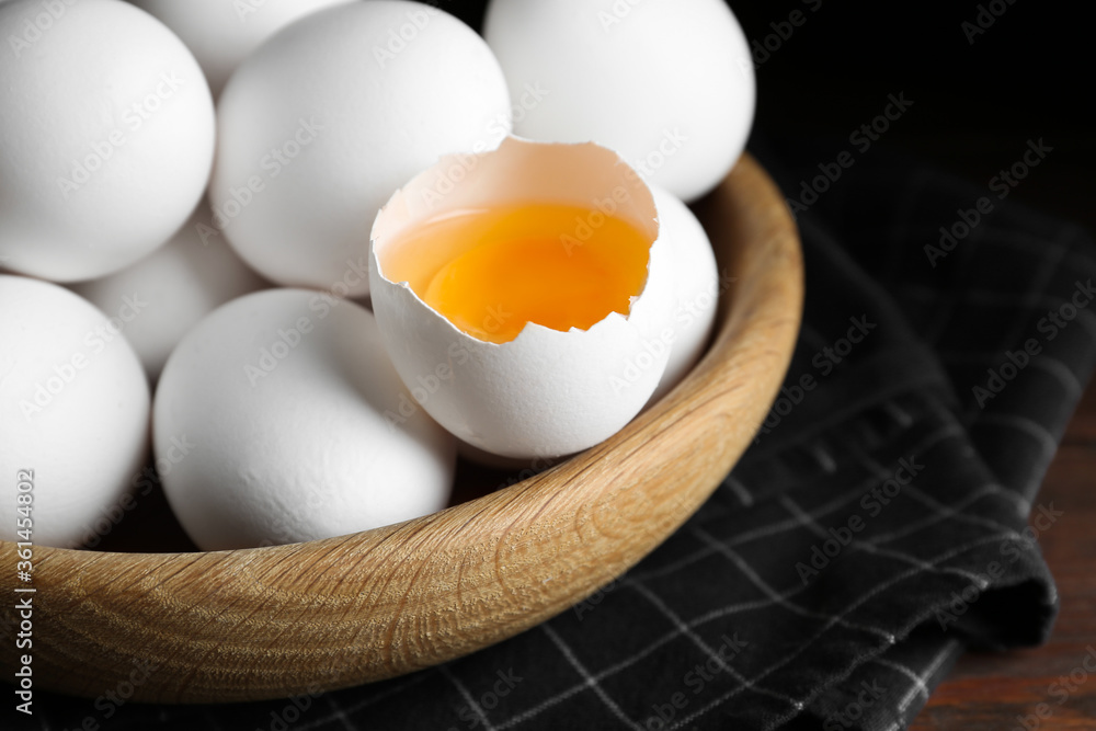 Many fresh raw chicken eggs in bowl on table, closeup Many fresh raw chicken eggs in bowl on table, closeup